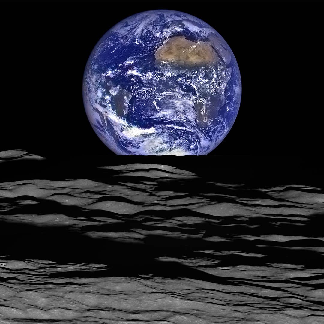 Earth seen whole above the lunar horizon, photographed from the Moon
